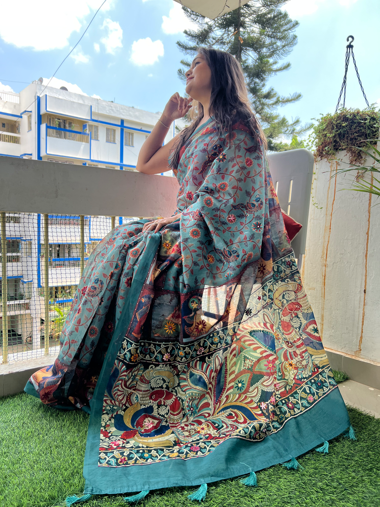 Kalamkari printed chandler silk with hand thread and mirror work.